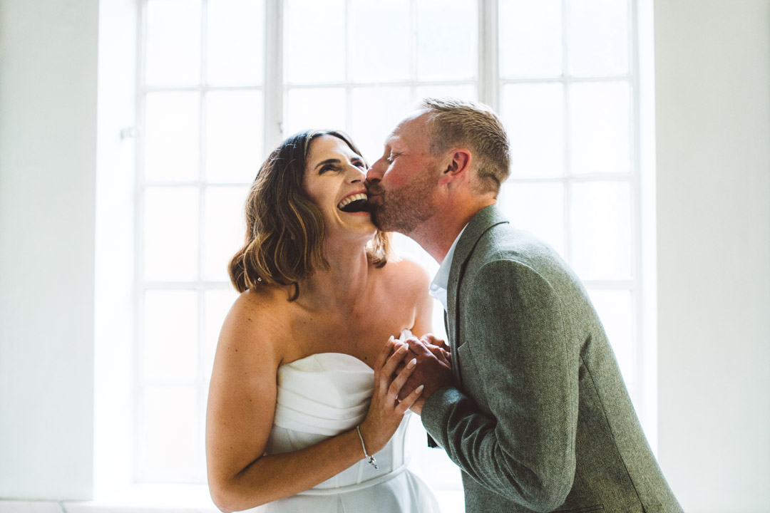 couple portrait newlyweds laughing