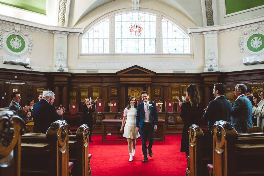 Islington Town Hall newlyweds walking out of Council Chamber