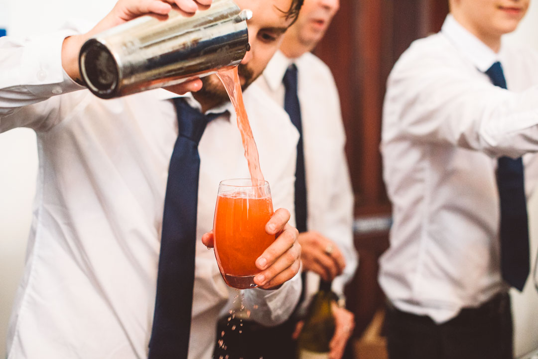 barman pouring cocktail