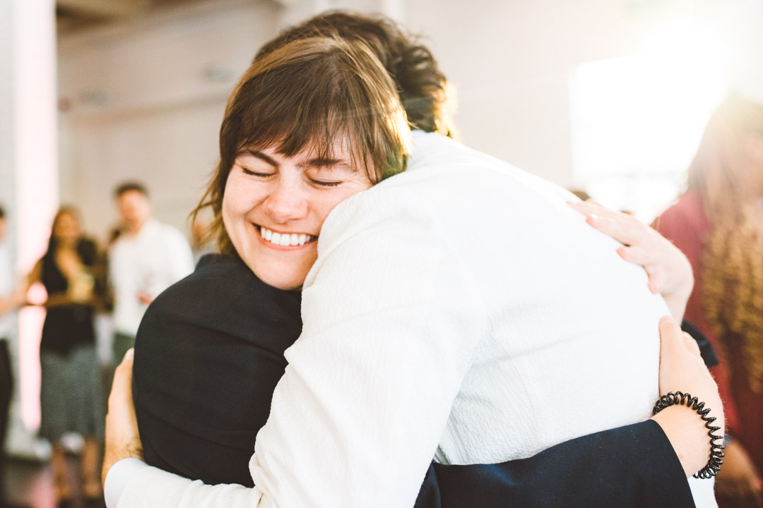 groom and best friend hugging