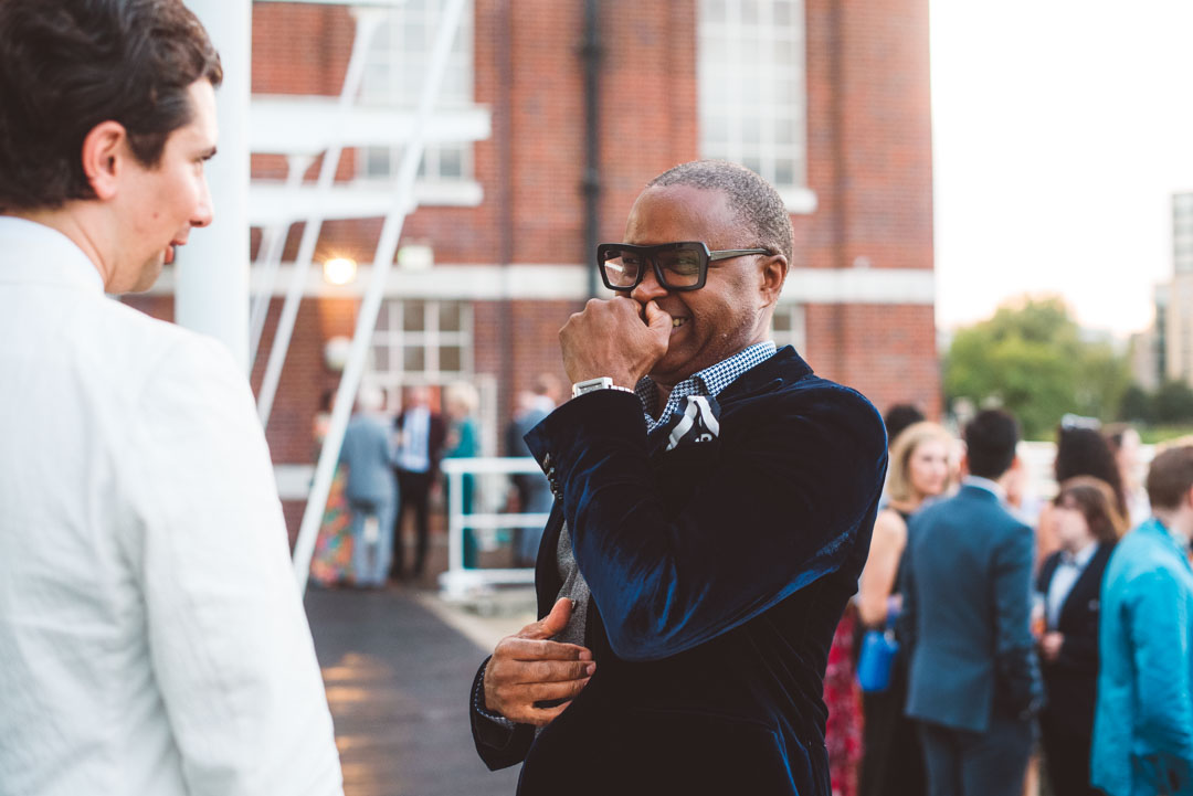 laughing guest candid wedding photo