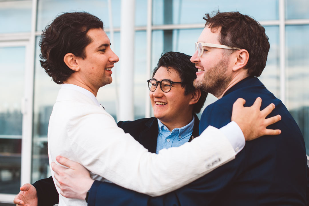 groom and friends hugging