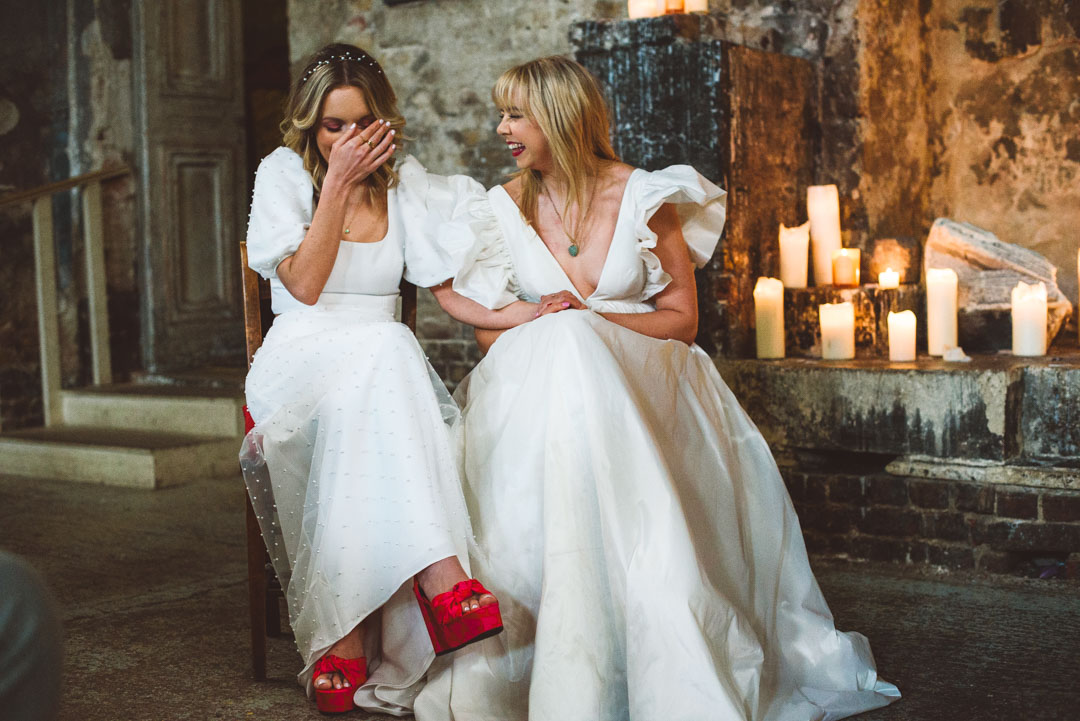 Asylum Chapel lesbian wedding brides laughing