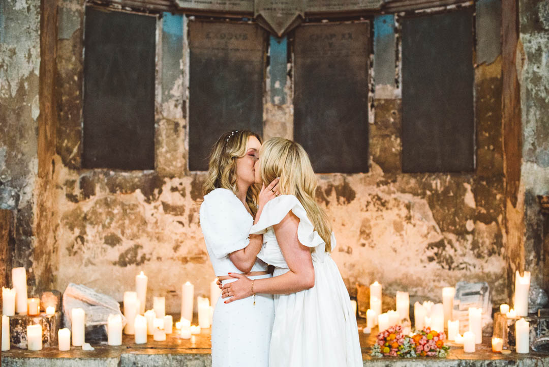 Asylum Chapel lesbian wedding brides kissing