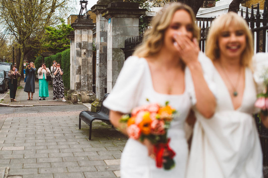 guests watching brides walk away