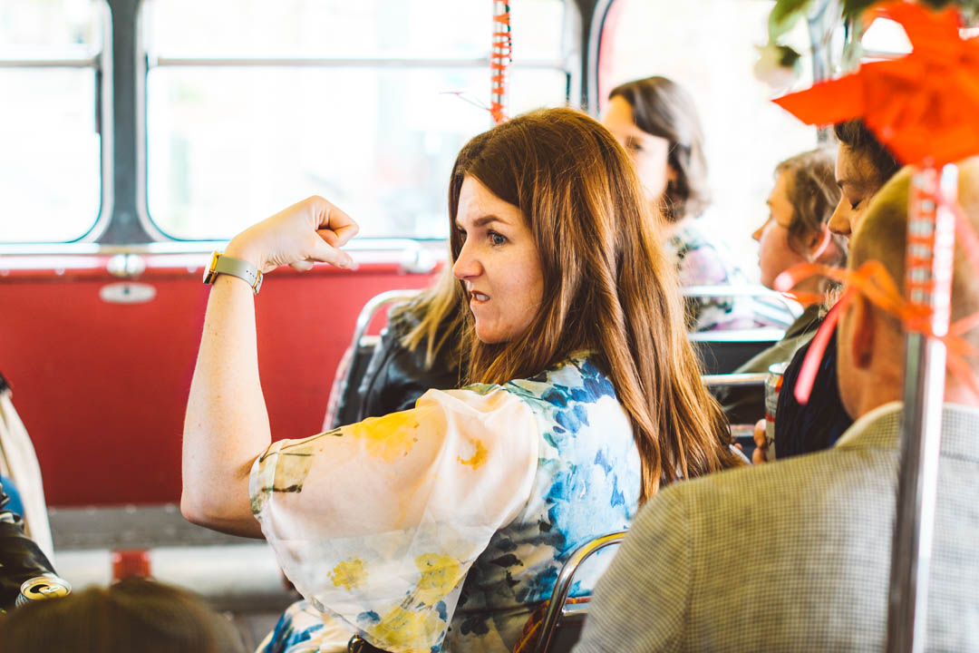 candid photo on wedding bus