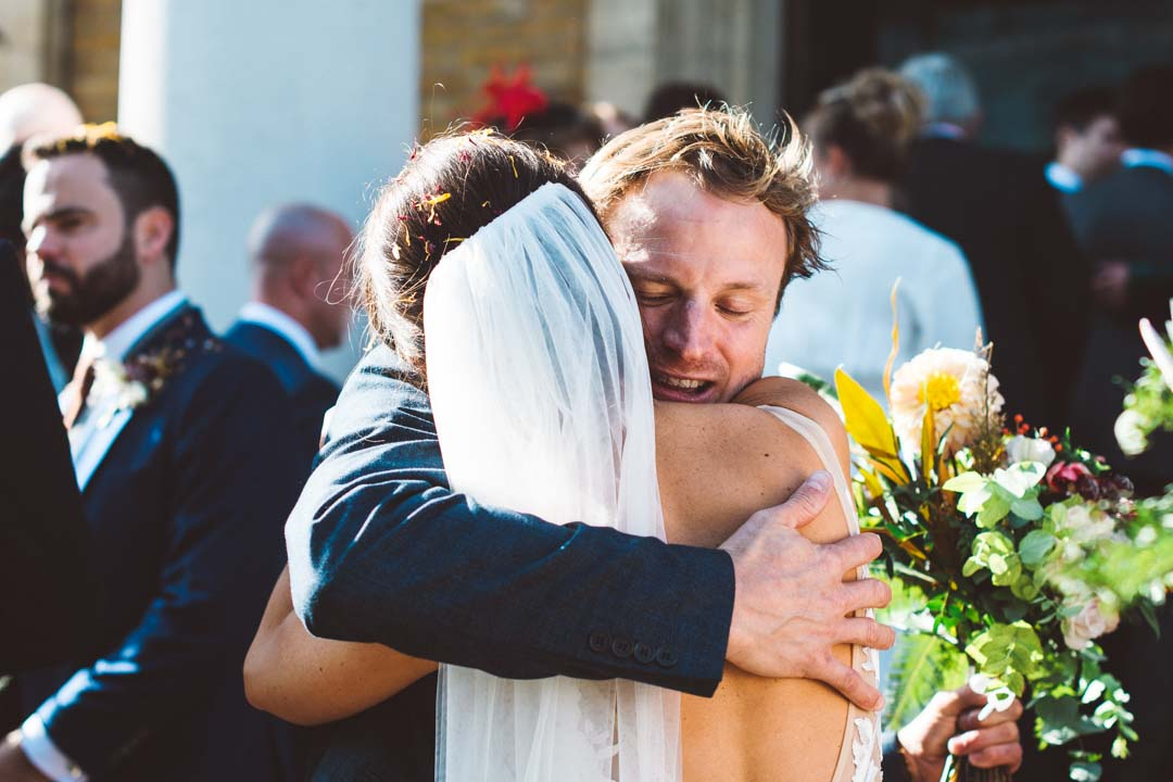bride and guest hugging