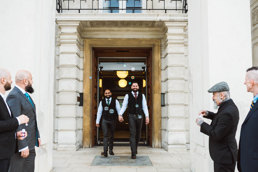 same-sex couple walking out Waltham Forest Town Hall