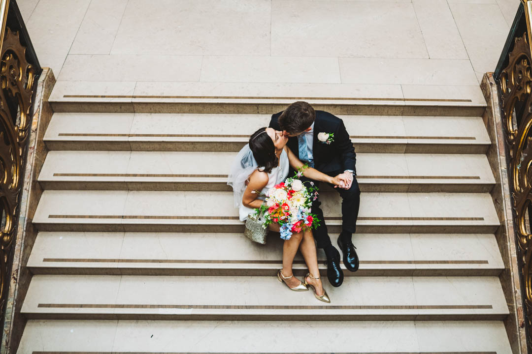 Wandsworth Town Hall couple sitting on marble staircase