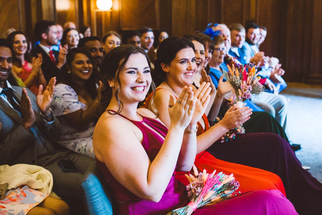 Old Marylebone Town Hall wedding guests applauding