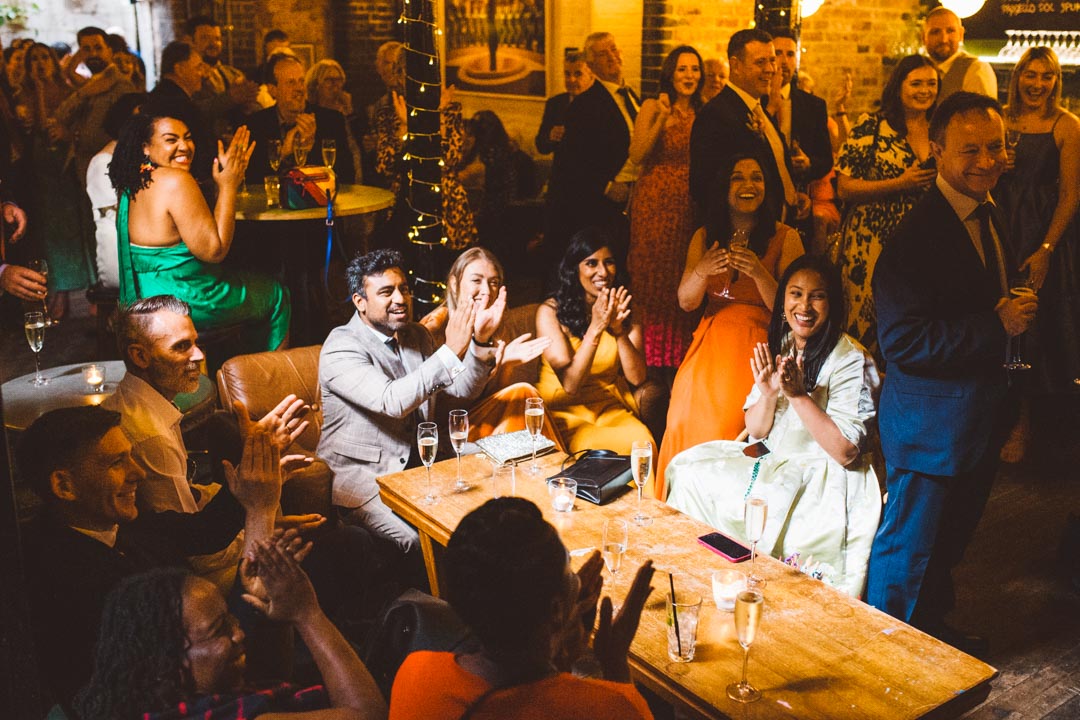Coin Laundry wedding guests cheering