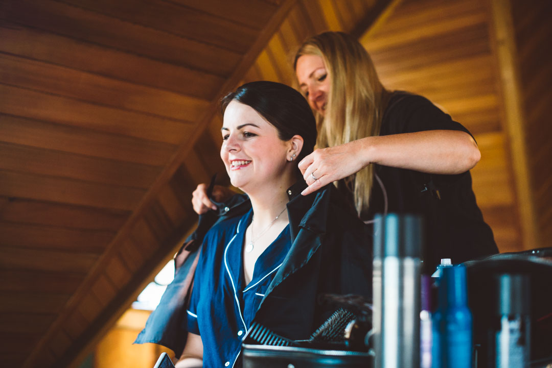 bridesmaid getting her hair done