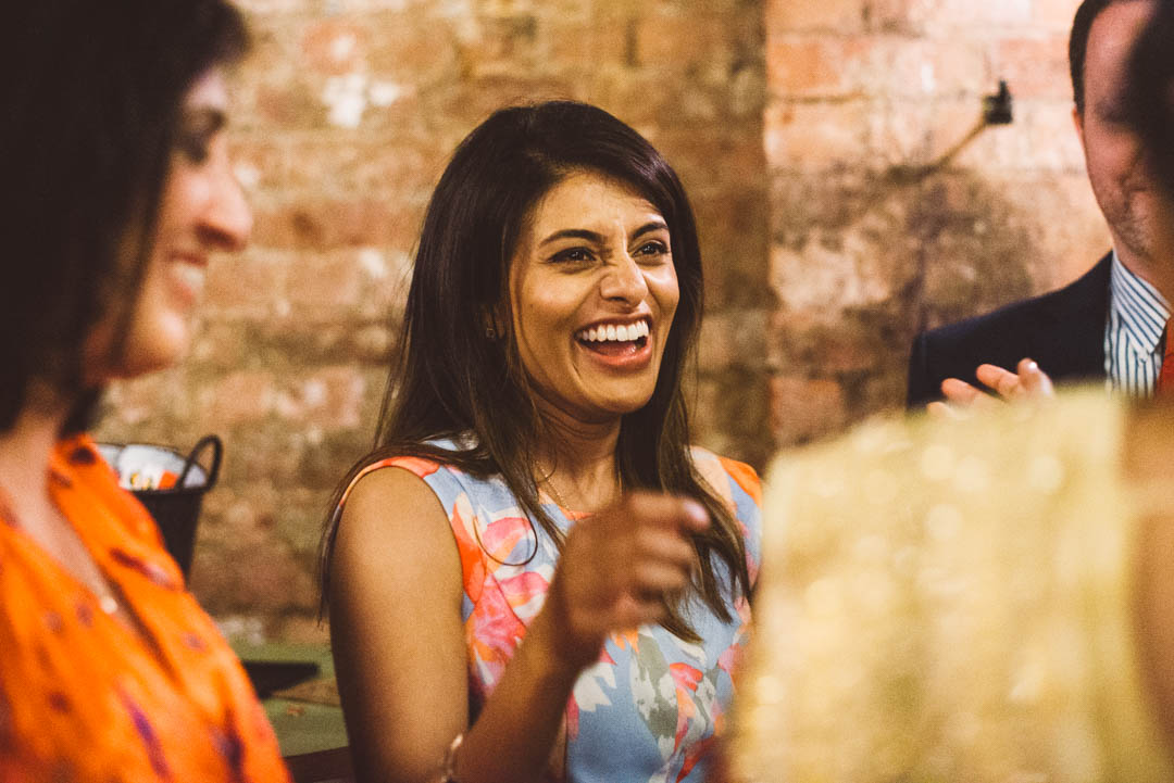 wedding guest laughing