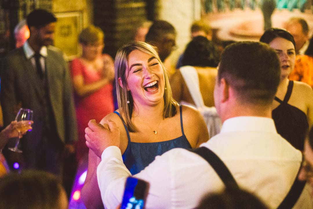 wedding guest laughing