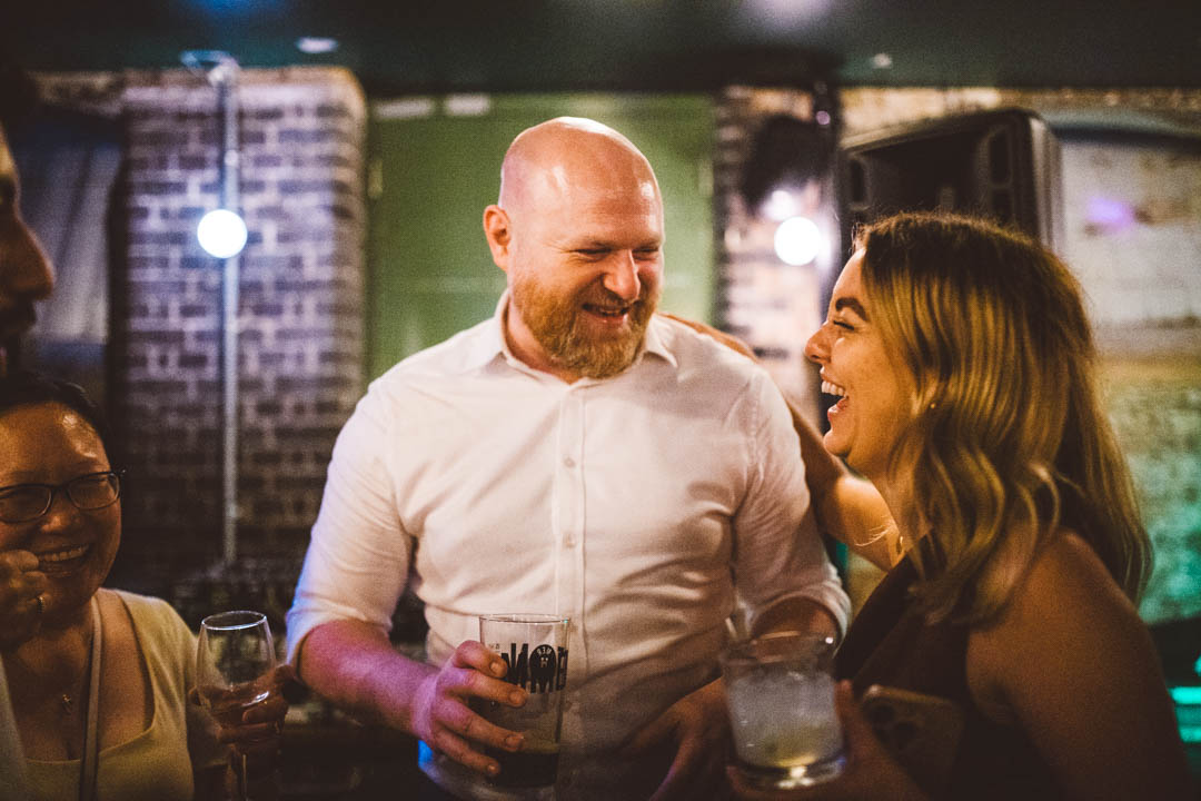 wedding guests laughing