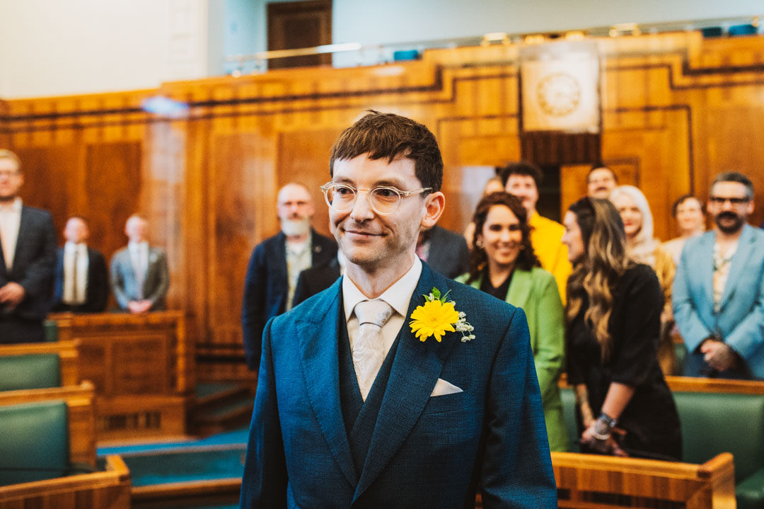council chamber groom walking down the aisle