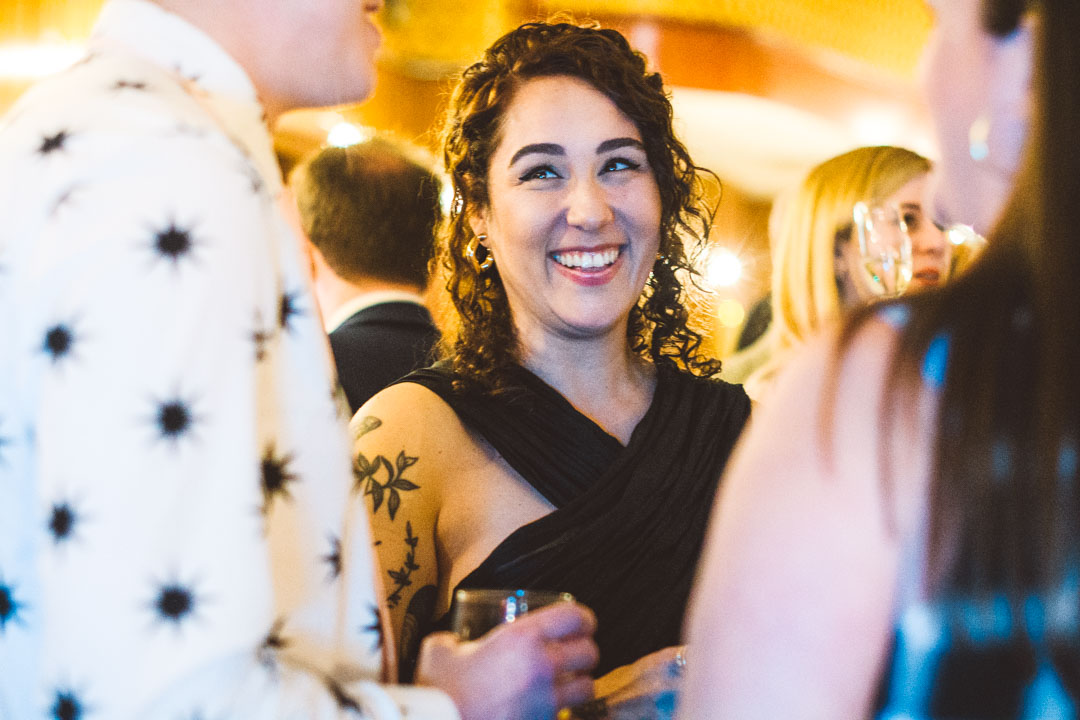 Candid wedding photo guest smiling