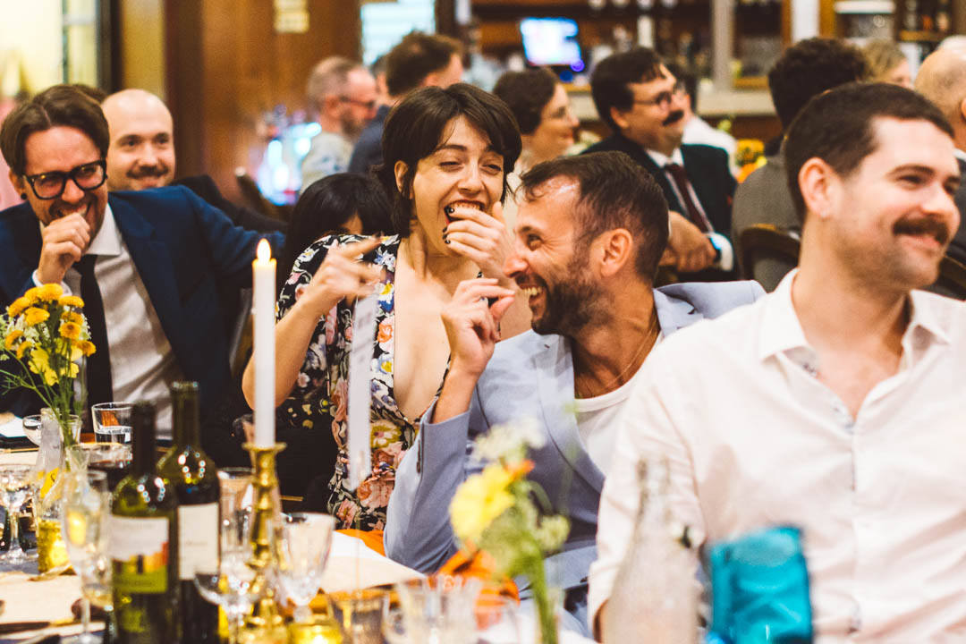 fun wedding photography guests laughing