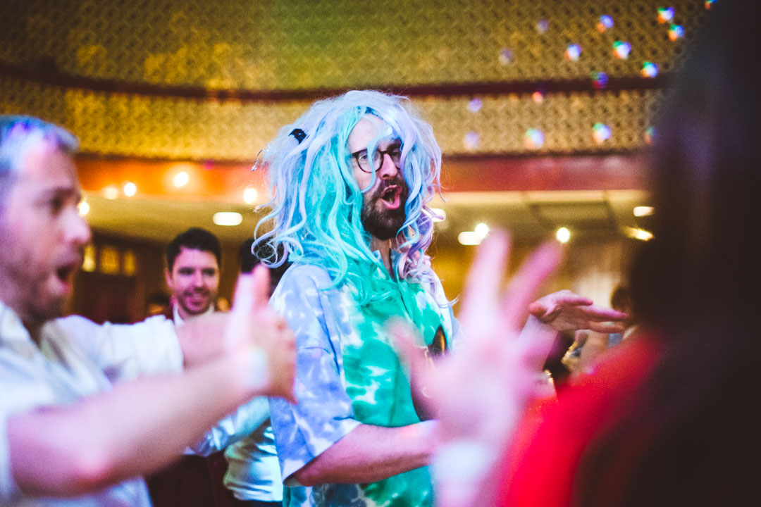 Mildmay Club wedding guest wearing blue wig