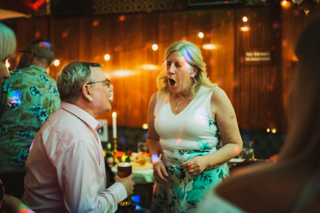 funny candid wedding photo guest signing