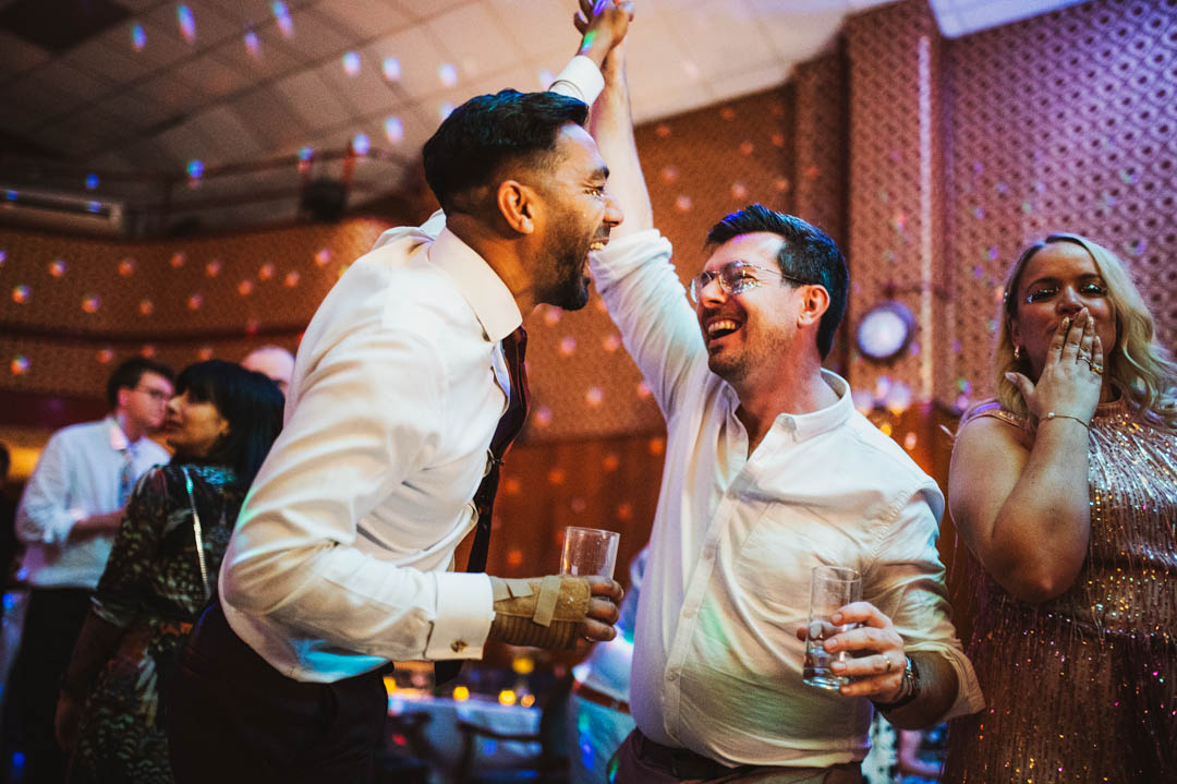 fun wedding photos guests on dancefloor