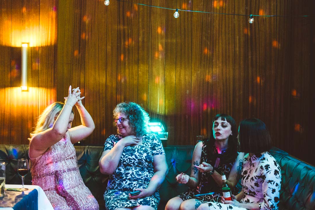 wedding party guests chatting