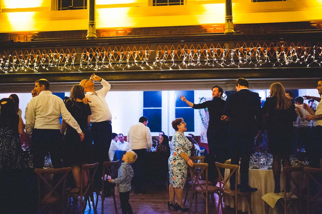 guests standing on chairs