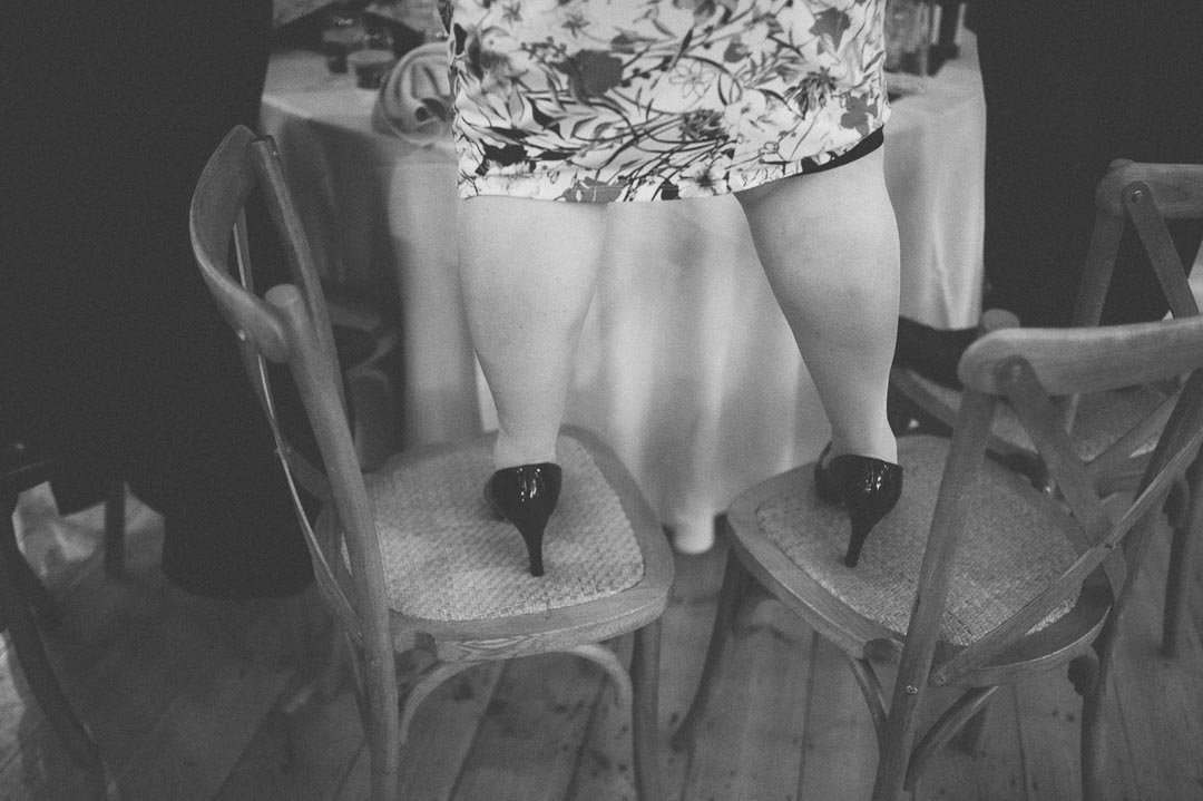 guest standing on chair detail