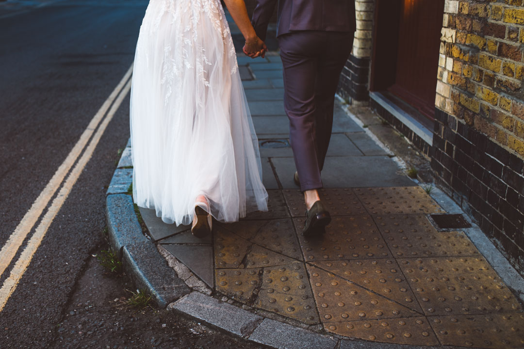 two brides walking hand in hand