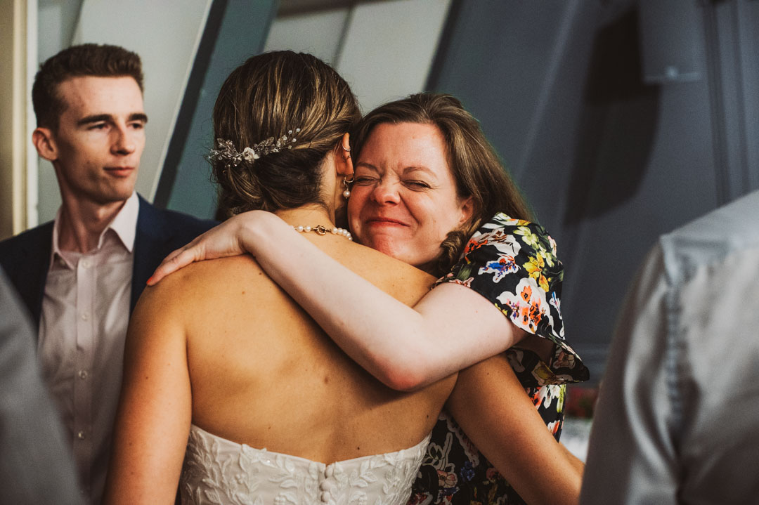 friend hugging bride