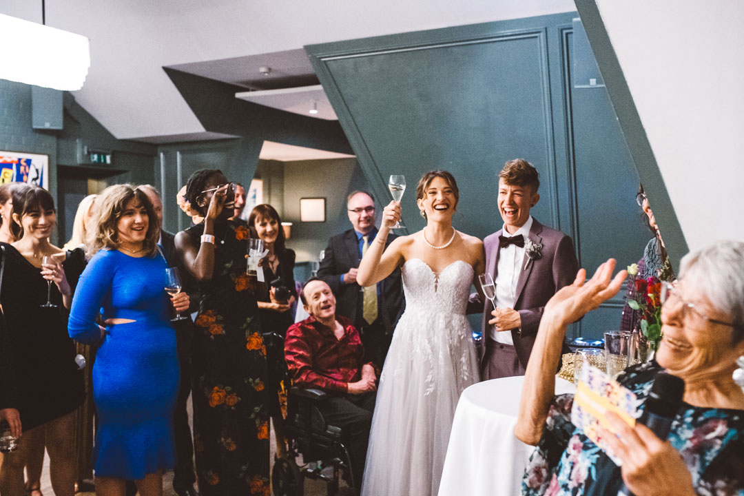 wedding guests reacting to speech