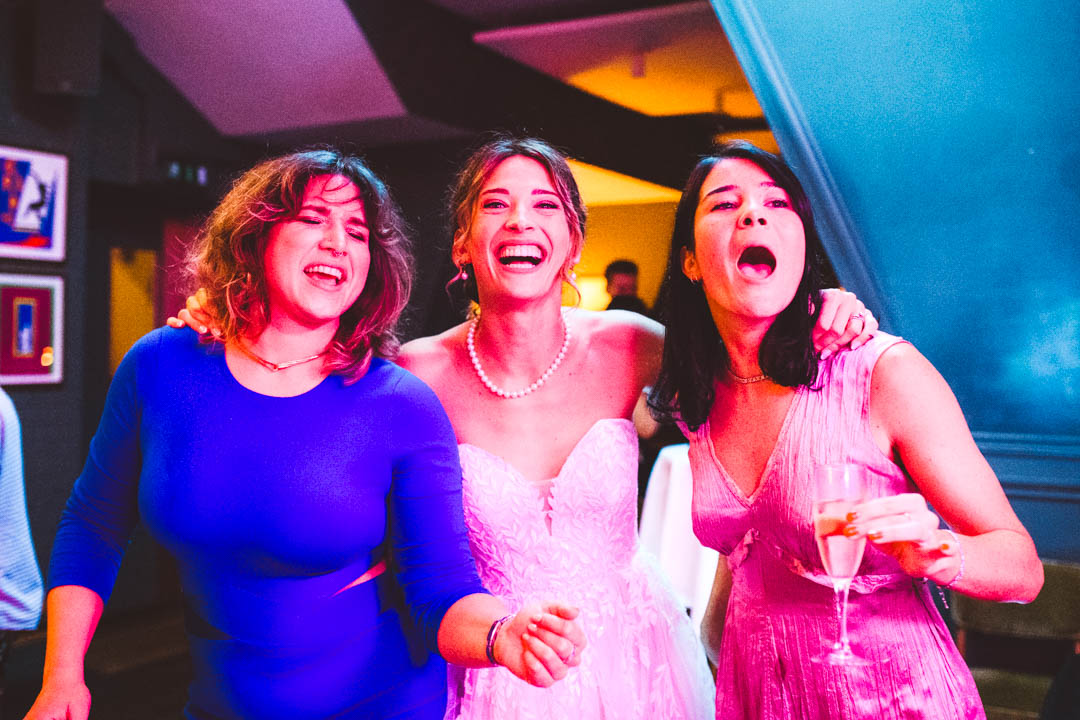 bride and friends dancing and singing