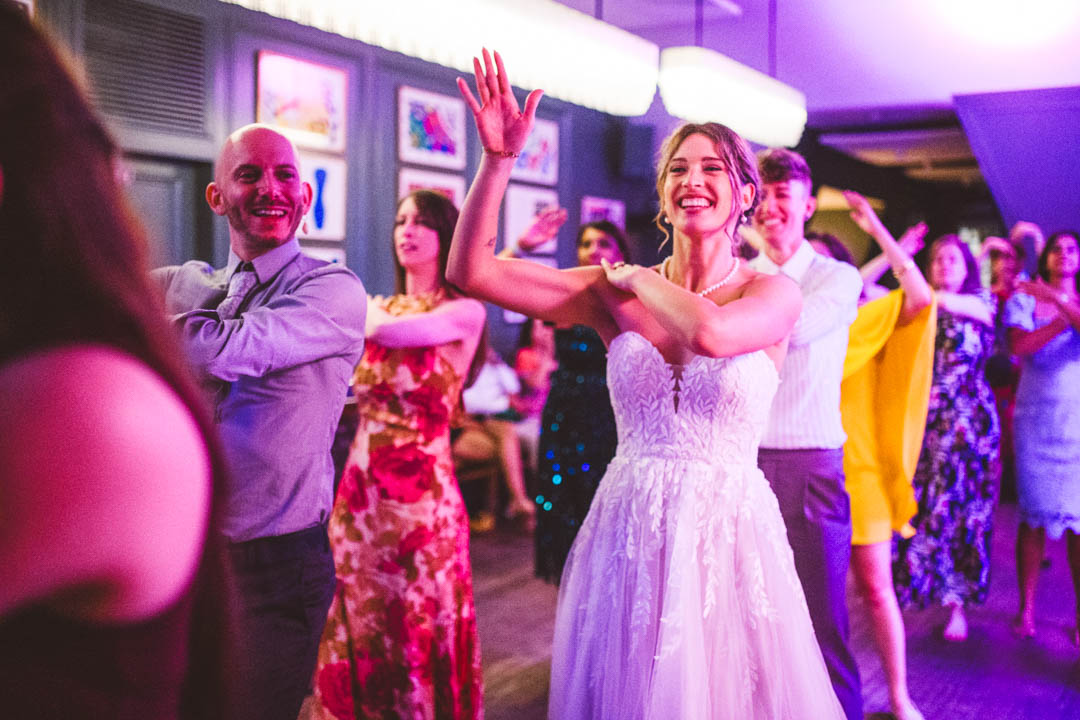 Swan at the Globe wedding macarena dancing