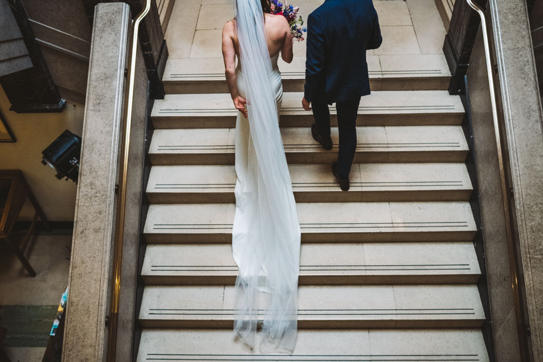 Town Hall Hotel Wedding couple walking up stairs