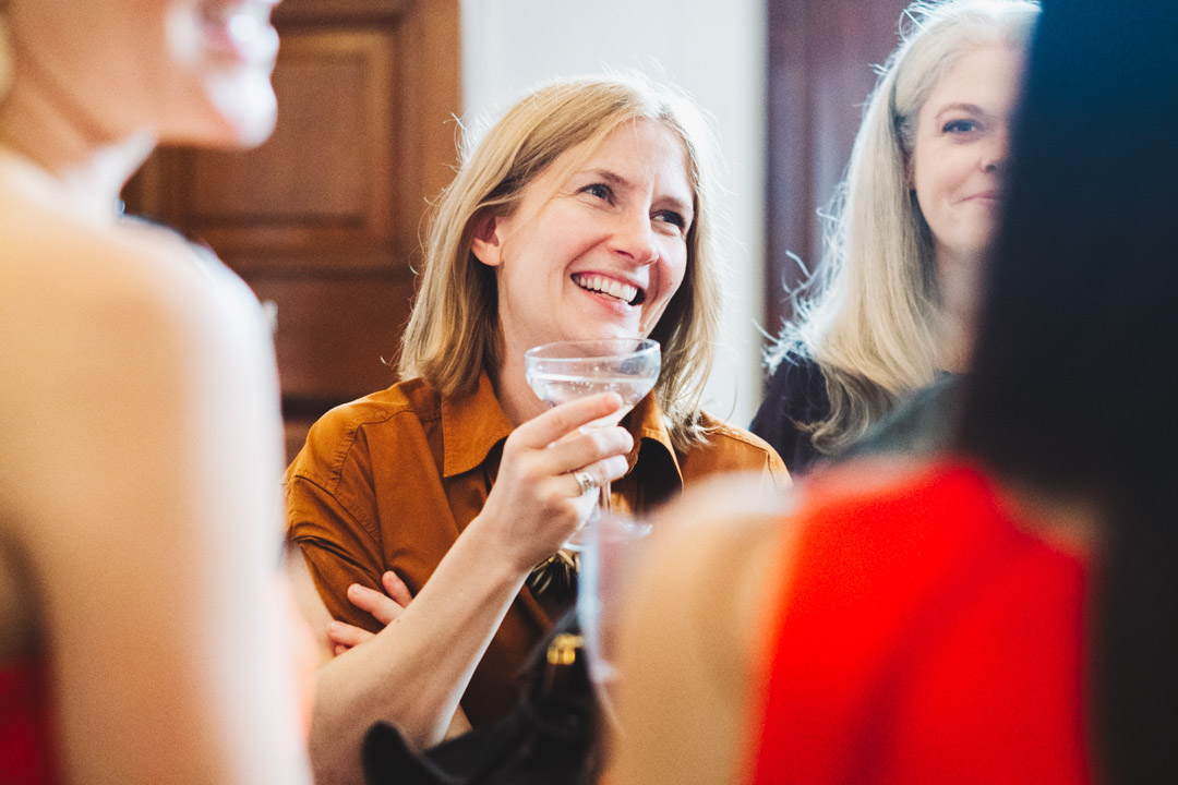 female guest holding a drink