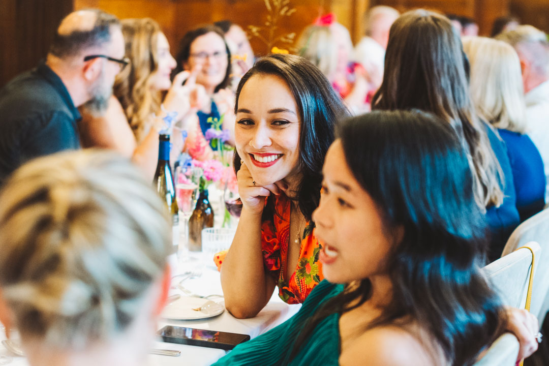candid shot of female guest smiling