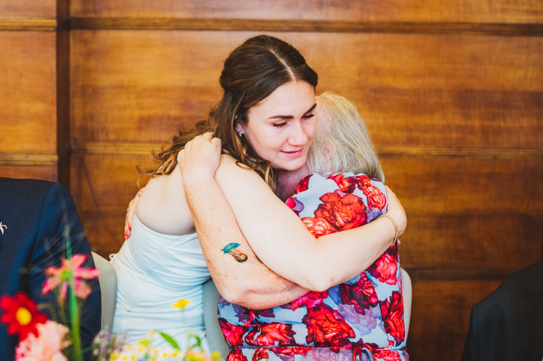 bride and mother-in-law hugging