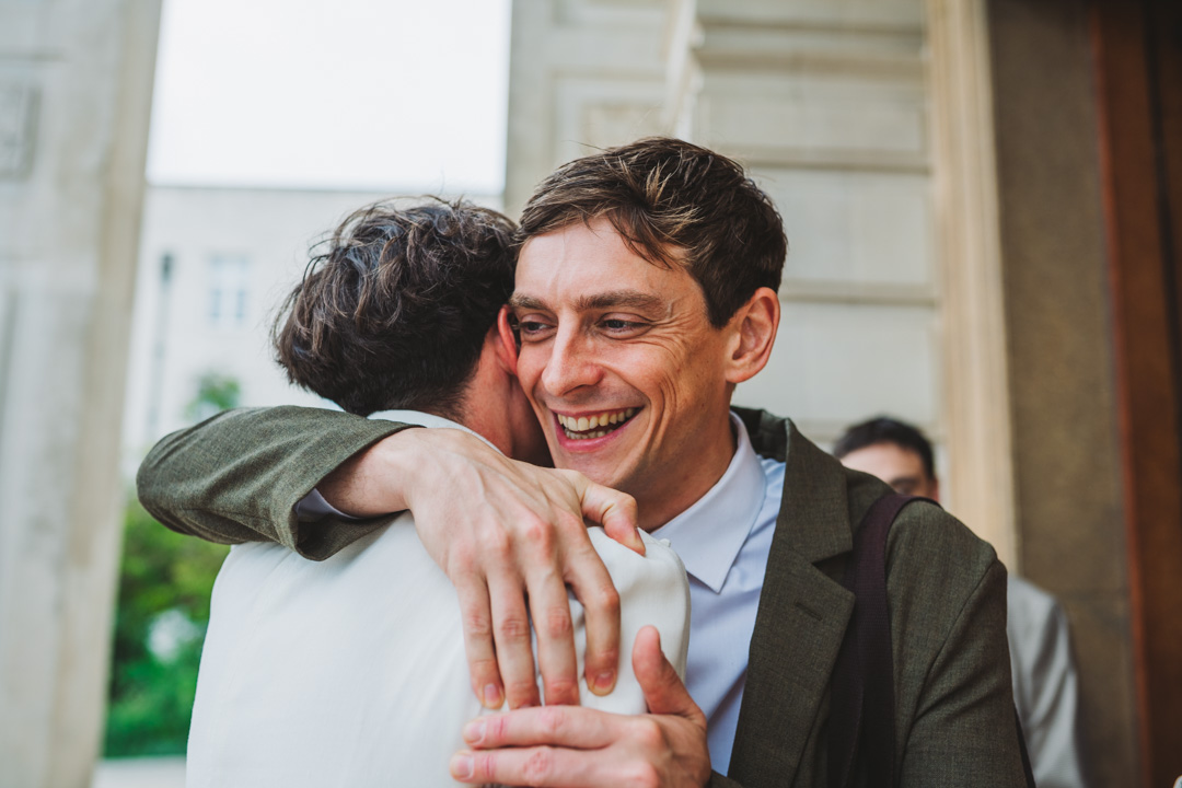 Waltham Forest Town Hall wedding groom and friend hugging