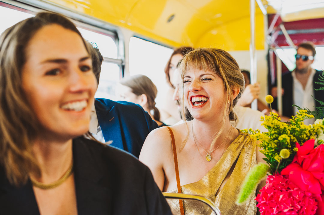 Waltham Forest Town Hall wedding candid photo of guest on wedding bus