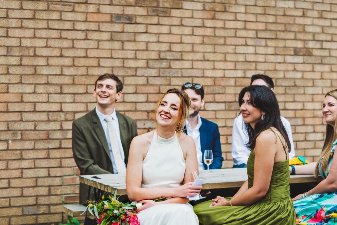 bride listening to groom's speech