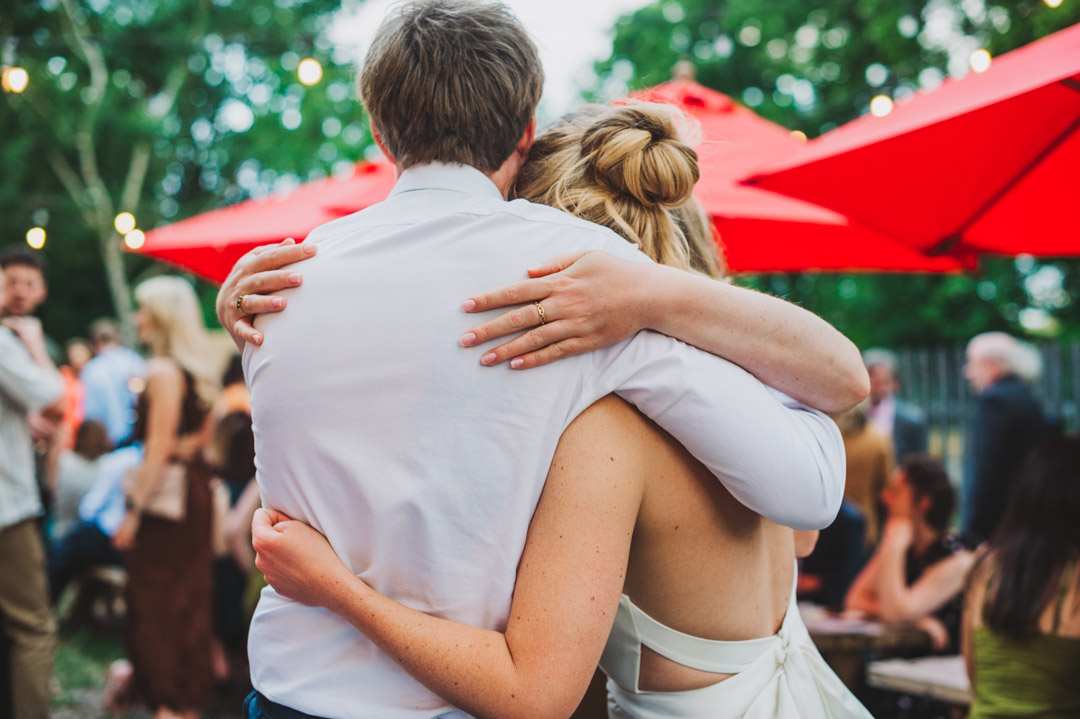 bride and siblings hugging