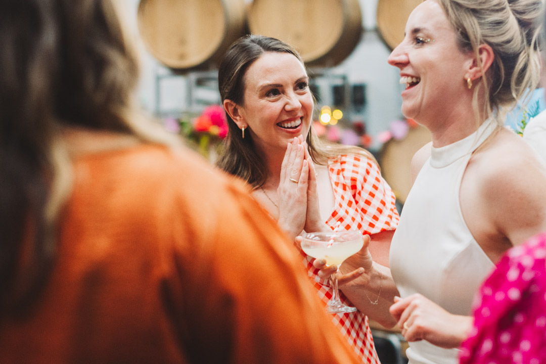 candid photo of guest listening to bride