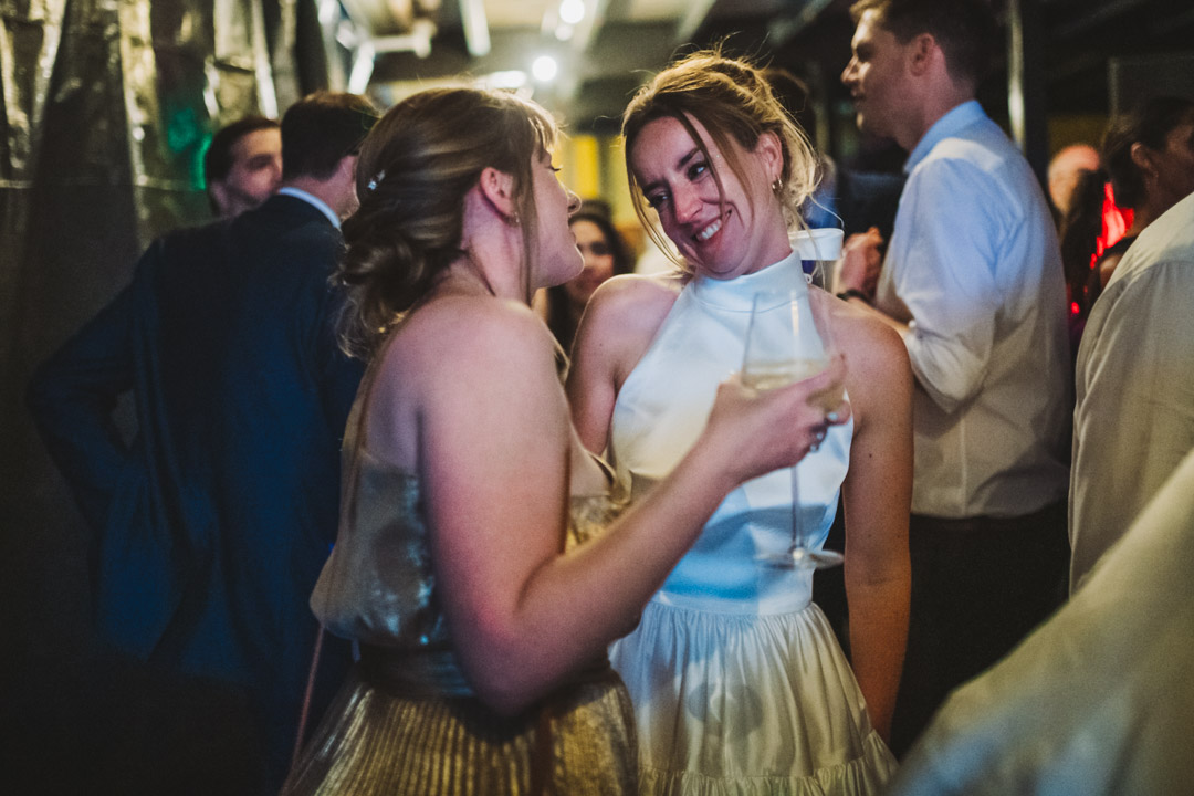 Renegade Urban Winery wedding bride and friend chatting