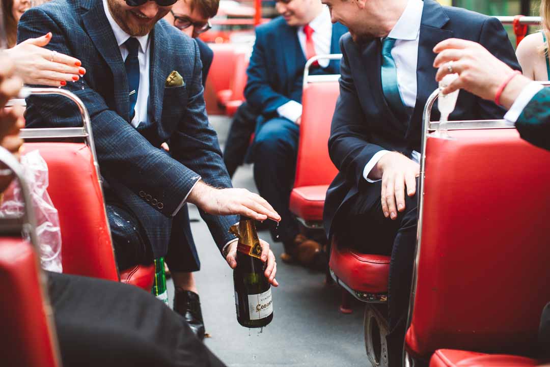 drinks on open top wedding bus