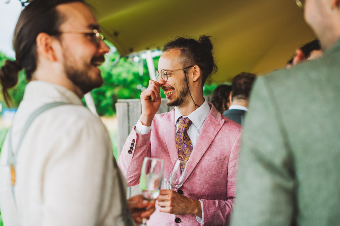 wedding guest laughing