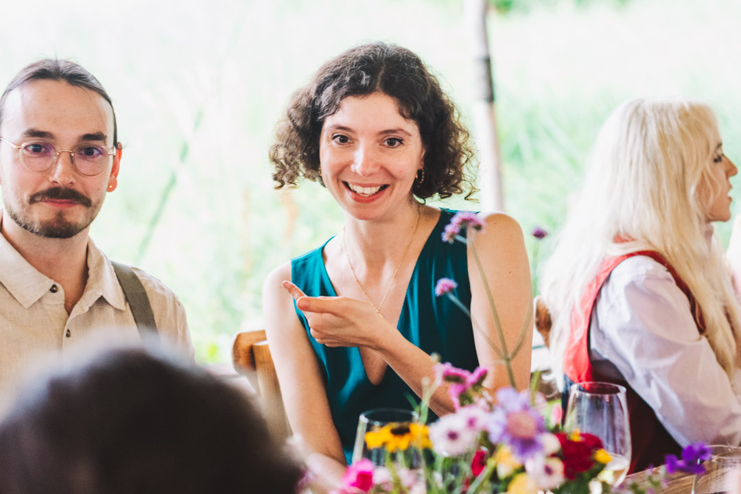 candid photo of wedding guests chatting