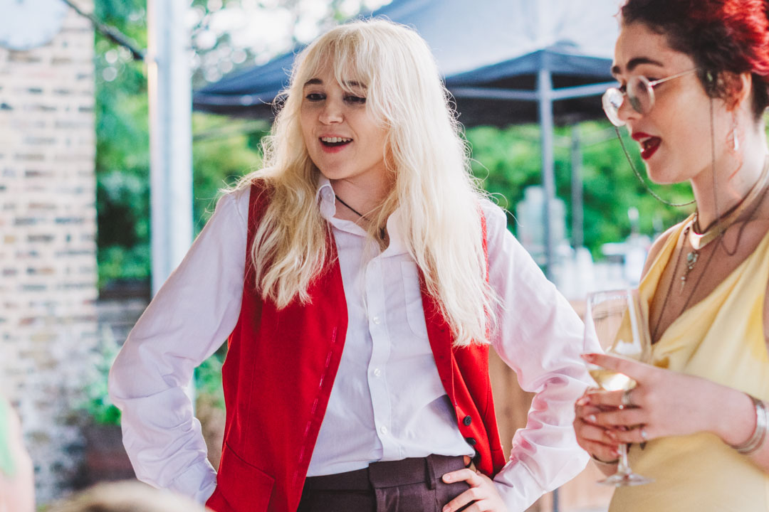 candid photo of female wedding guests chatting
