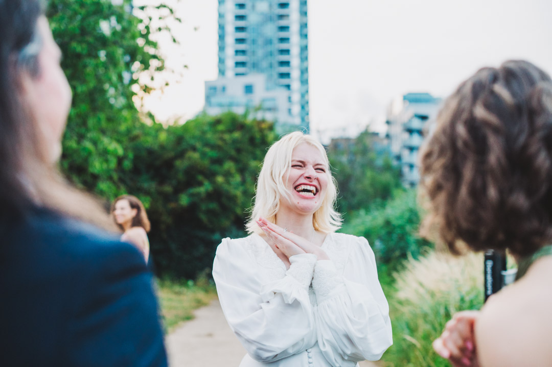 Woodberry Wetlands wedding bride bursting into laughter